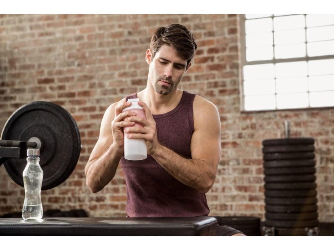 man-shaking-shaker-bottle-3-1067x800